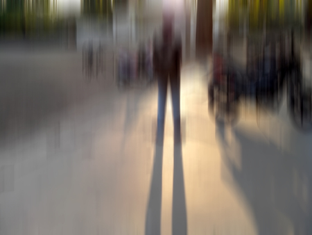 two human figure during sunset in street. shot taken with motion blur effect.の写真素材