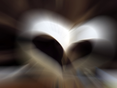 Pages of a book curved into a heart shape.Shot with motion blur effect.の写真素材