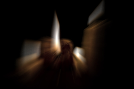 Three candles shot with motion blur effect.の写真素材