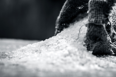 Raw organic rice,Oryza sativa, coming out from a gunny bag.の写真素材