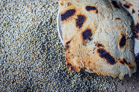 Roti/Chapati of Pearl millet/bajra/Pennisetum glaucum with whole grains of pearl millet.