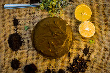 Henna,Lawsonia inermis paste with natural ingredients i.e. lemon,citrus Ã limon,Indian iliac,azadirachta indica,neem paste with coffea,coffee powder.の写真素材