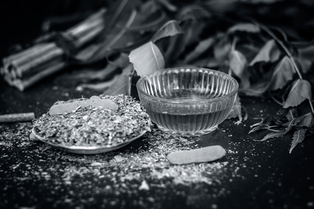 Close up of Indian iliac's powder with its branch of tree and turmeric and honey for teeth care.の写真素材