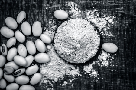 Close up of ayurvedic herb kuanch,cowhage,Mucuna pruriens with powder.の写真素材