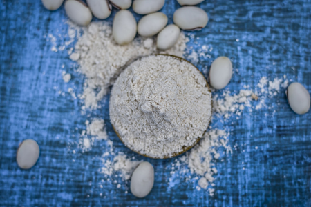 Close up of ayurvedic herb kuanch,cowhage,Mucuna pruriens with powder.の写真素材