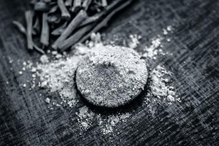 Close up of ayurvedic herb satavari,Asparagus racemosus with its powder and root.の写真素材