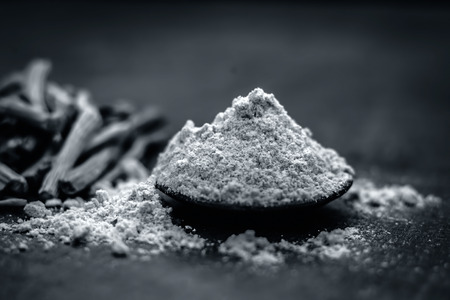 Close up of ayurvedic herb satavari,Asparagus racemosus with its powder and root.