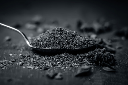 Close up Star aniseed,Illicium verum powder in a antique spoon.の写真素材