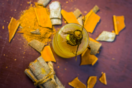 Close up of oil of cinnamon,Cinnamomum zeylanicum  with whole cinnamon and its powder.の写真素材