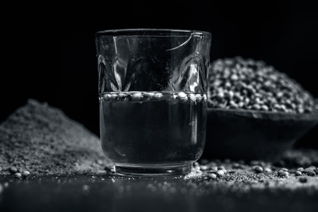 Close up of water of Coriandrum sativum,Coriander with its powder.の写真素材