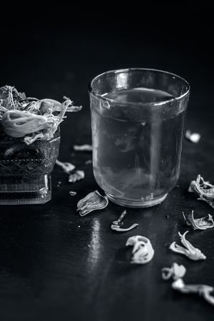 Close up of water of mace,javantri or Myristica fragrans in a glass with raw mace.の写真素材