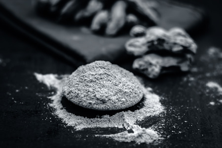 Close up of dry ginger,Zingiber officinale with its powder.の写真素材