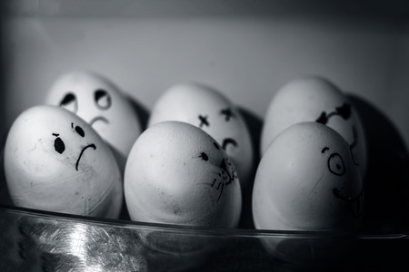 Close up of Eggs with drawn funny faces.の写真素材