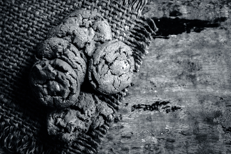 Homemade freshly baked chocolate chip cookies on gunny background.;の写真素材