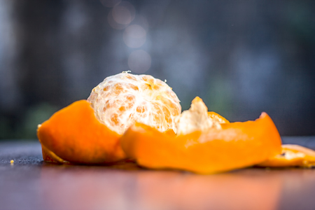 Close up of fresh ripe oranges,Citrus aurantium without peel on wooden surface.;の写真素材