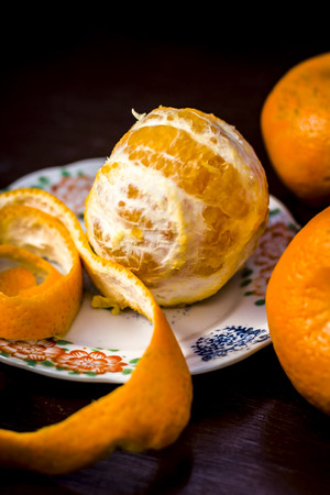 Close up of fresh ripe oranges,Citrus aurantium without peel on wooden surface.;の写真素材