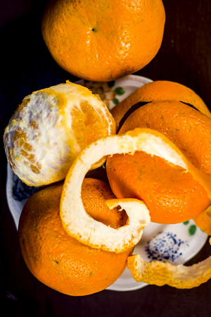 Close up of fresh ripe oranges,Citrus aurantium without peel on wooden surface.;の写真素材