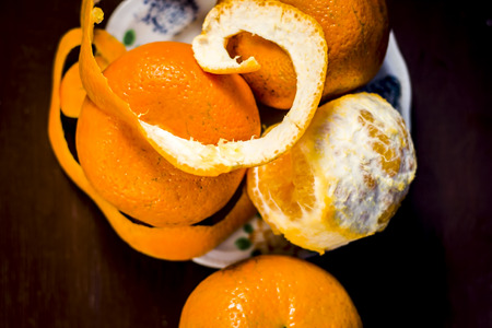 Close up of fresh ripe oranges,Citrus aurantium without peel on wooden surface.;の写真素材