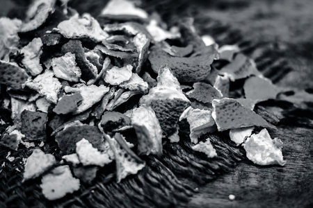 Close up of dried peel of orange,Citrus aurantium on a gunny background used as a face pack and for skin care.の写真素材