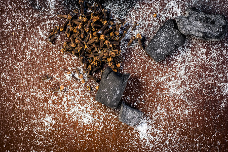 Mixture or ingredients of the traditional toothpaste made in Asia i.e. Coal powder, powder of neem bush, clove, and salt, sodium chloride.の写真素材