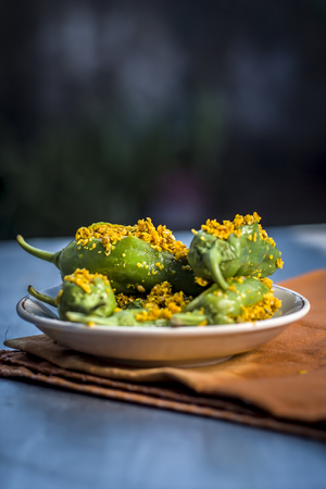 Green chilli pickle marinated in mustard seeds and mustard oil.の写真素材