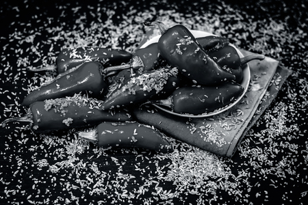 Red chilli pickle marinated in mustard seeds and mustard oil. Dark gothic style still life concept.の写真素材