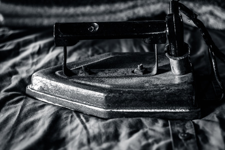 A rusted iron on a blue shiny shirt.の写真素材