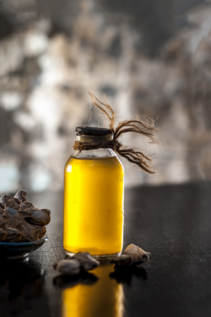 Dried ginger or soth or Zingiber officinale with nutmeg powder and its extracted oil for good digestion and medicine for headache.の写真素材