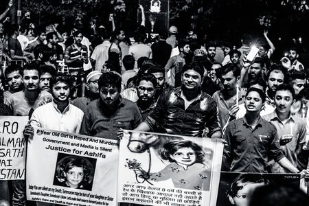 JUNAGADH-GUJARAT-INDIA APRIL 2018: Candle March and Protest by Hindus and Muslims against the torture and rape of 8 years old girl Asifa who was strangled and stoned to death in Kathua.のeditorial素材