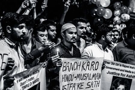 JUNAGADH-GUJARAT-INDIA APRIL 2018: Candle March and Protest by Hindus and Muslims against the torture and rape of 8 years old girl Asifa who was strangled and stoned to death in Kathua.のeditorial素材