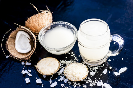 Close up of famous regional drink of India apong shrabat or tender coconut shrabat on wooden surface with the entire ingredients.の写真素材