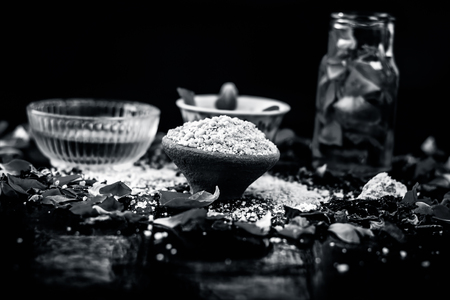 Ayurvedic ubtan of Rose water,gram flour,oats and rose petals or face pack on wooden surface helps in removing pimples,dead skin and smooth  the dried skin and give a moisture.の写真素材