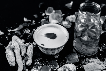 Ayurvedic face pack to reduce or to decrease the chance of wrinkles, pimples, acnes, black heads and dull skin is Rose face pack with entire ingredients on i.e. Rose water, turmeric, and gram flour.の写真素材