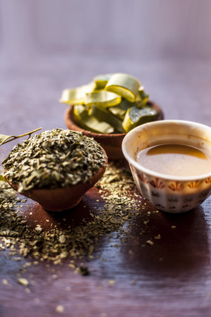 Indian Ayurvedic face pack best to cure acnes and pimple along with black heads i.e. Face pack or ubtan of Neem or iilac and aloe vera with Neem fruit on wooden surface.の写真素材