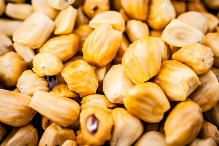 Raw Jackfruit or kathal or jak or Artocarpus heterophyllus in the market with its yellow colored...