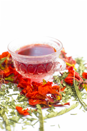 Close up of orange or red colored tea of Gular or Flame tree's flowers isolated on white.の写真素材