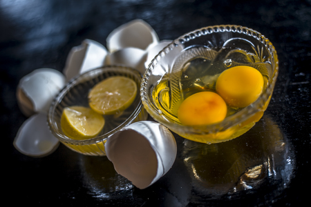 Close up of unique way to have calcium or ayurvedic home remedy for calcium supplement : eggs with lemon juice.の写真素材