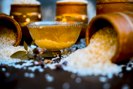 Close up of effective face pack for Burning Sun Tans, Raccoon Eyes, and as a Skin Lightening Face Mask of rice water with egg yolk all the ingredients on wooden surface.;の写真素材