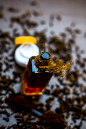 Close up of home remedy for Acne: Clove oil add it to any facial cream use it twice a day. Effective ayurvedic home remedyâs ingredients on wooden surface.;の写真素材