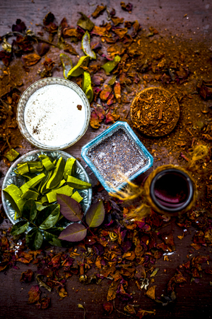 Close up of Aloevera with sandal wood powder and milk with rose water on wooden surface for acne free skin.の写真素材