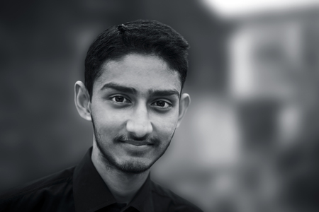 portrait of a handsome gentle man or business man wearing black colored shirt,Posing and smiling as achieved something of proud.の写真素材