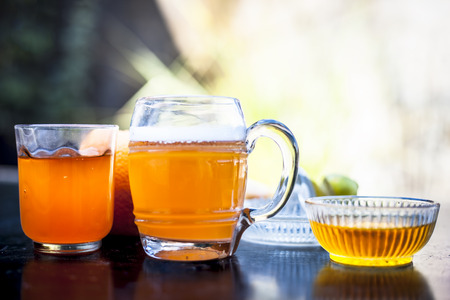 Close up of popular summer drink i.e. Ginger beer on wooden surface with