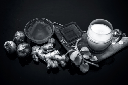 Close up of hair treatment for loss due to lice on wooden surface i.e Onion and ginger juice which helps in blood circulation and in hair growth by decreasing hair loss.の写真素材