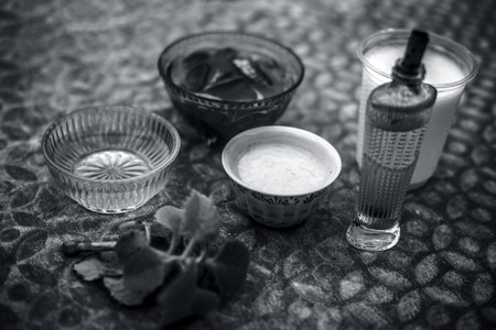 Close up of treatment to keep scalp healthy on brown colored surface i.e. aloevera gel,yogurt,honey and olive oil.の写真素材