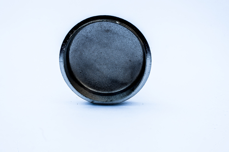 Close up of decorative small container isolated on white with silver cover on it and colorful designs.の写真素材