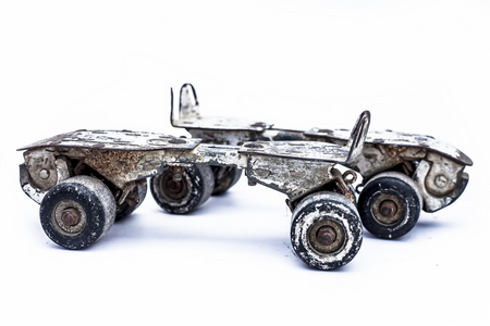 Close up of white and brown colored roller skates or roller skate shoe isolated on white.の写真素材