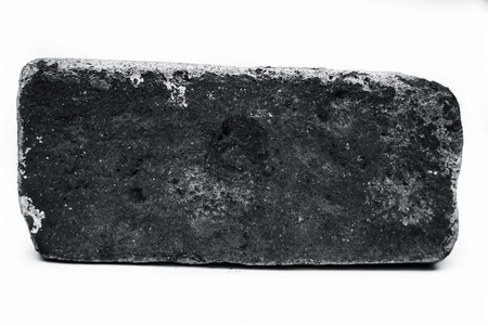 Close up of brown colored brick isolated on white.の写真素材