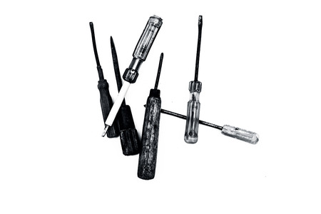 Close up of bunch of different sized screwdrivers isolated on white.