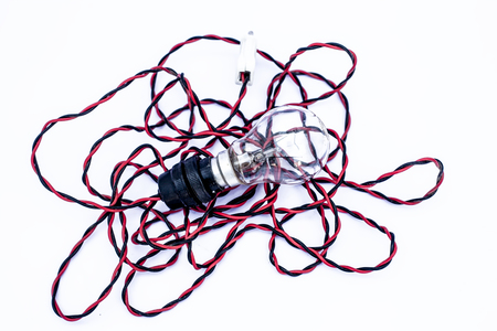 Close up of bulb with holder and red black color wire with it isolated on white.の写真素材