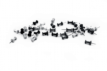Close up of colorful push pins or isolated on white.